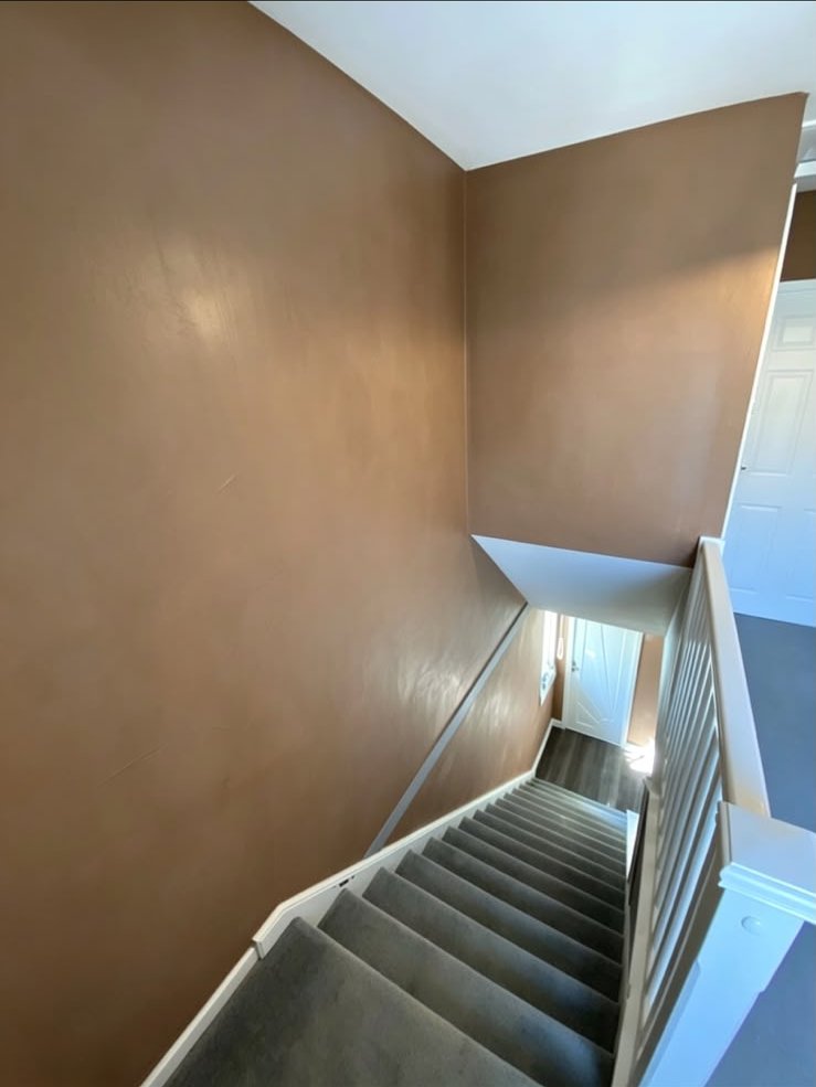 Stairwell walls with a smooth skim finish